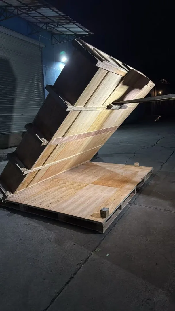 Original nighttime photograph of the U.S. project's oversized wooden packing support rebuilt to hold the cargo at an angle before loading.